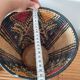 Ethnic basket in multicolored braided straw