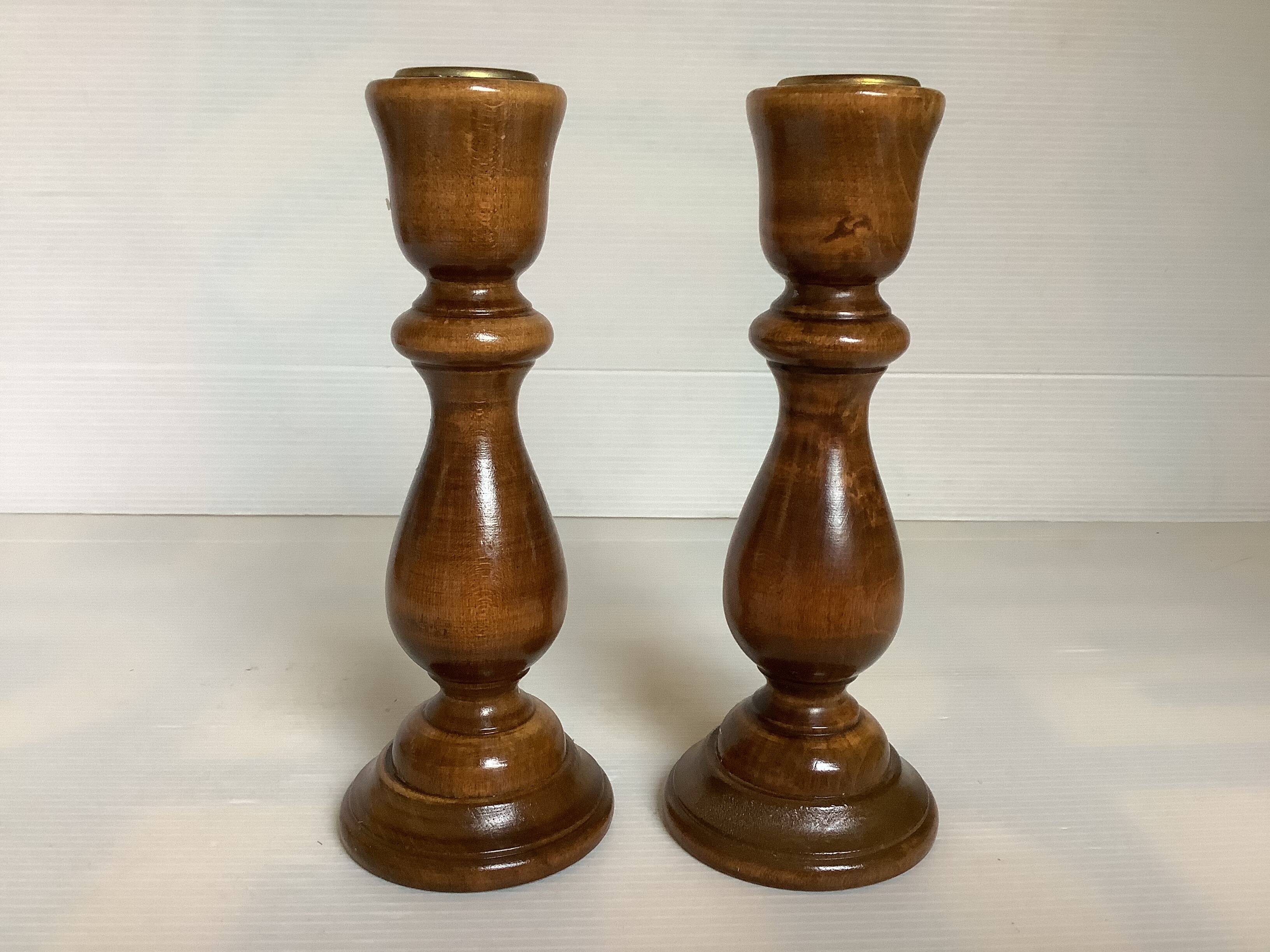 Pair of varnished wooden candlesticks