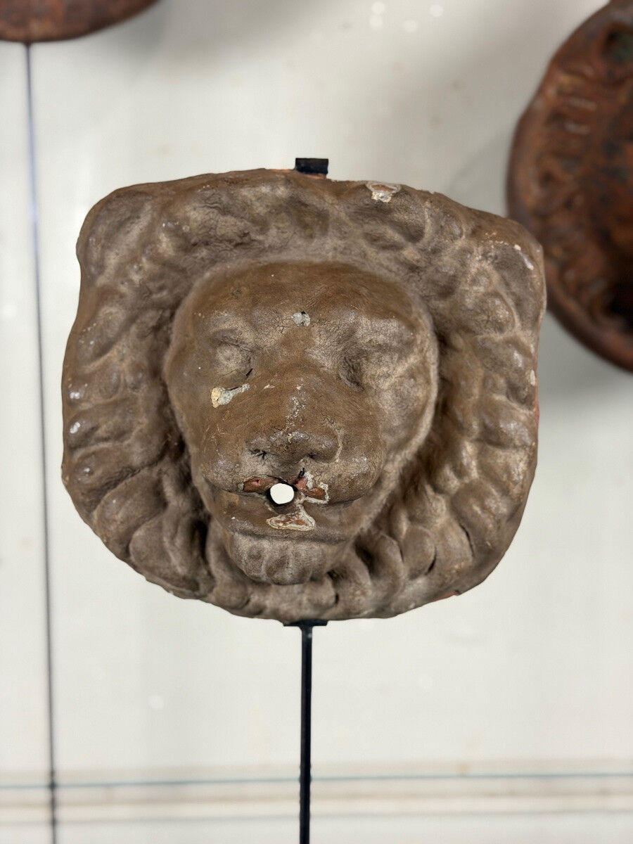 Three cast-iron and terracotta façade decoration lions, around 1880.