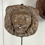 Three cast-iron and terracotta façade decoration lions, around 1880.