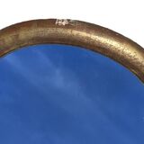 Large gilded wooden mirror in the shape of a gendarme hat