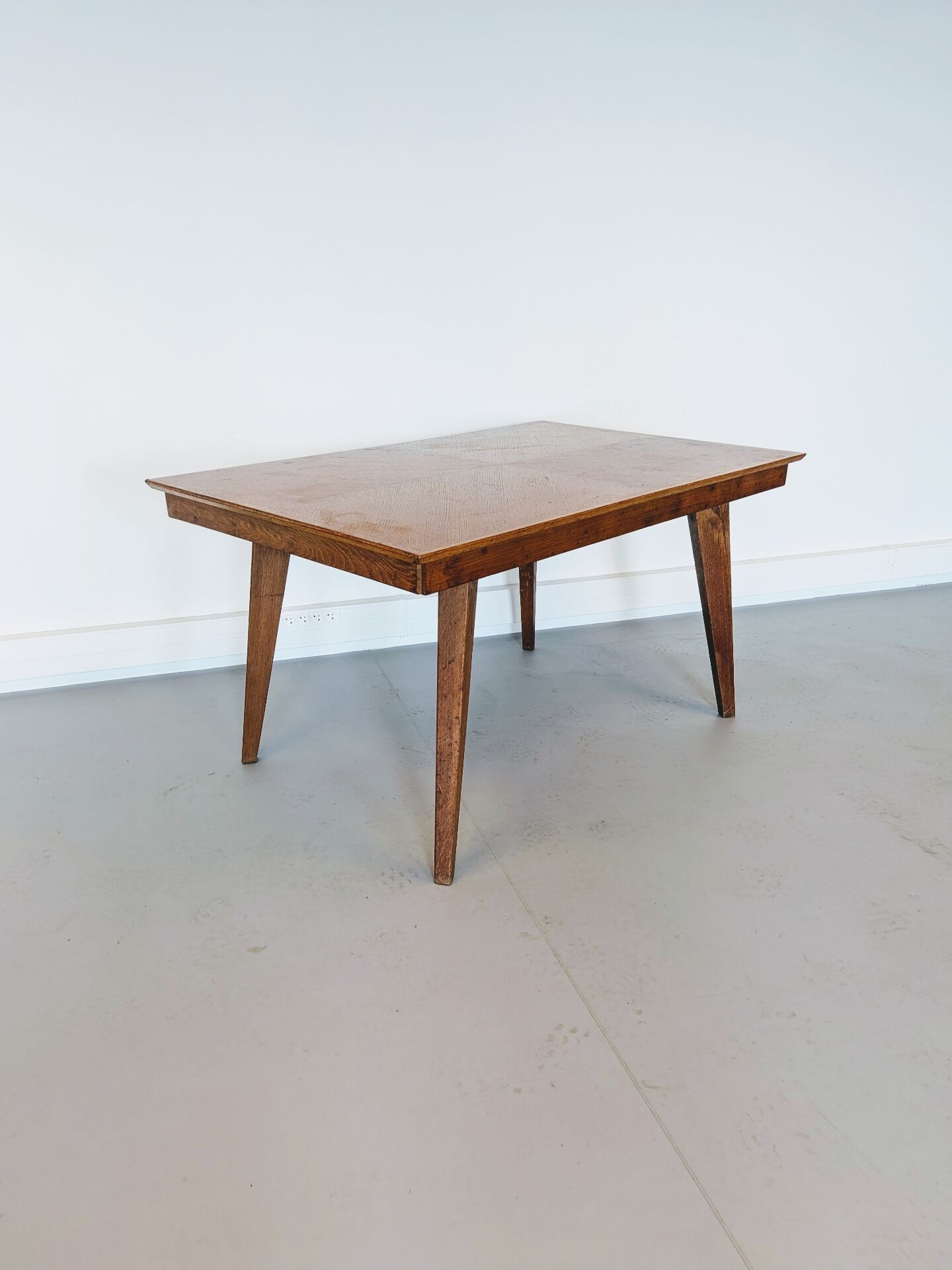 Vintage Scandinavian wooden dining table with tapered legs.