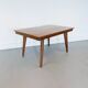Vintage Scandinavian wooden dining table with tapered legs.