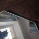 Three beveled mirrors