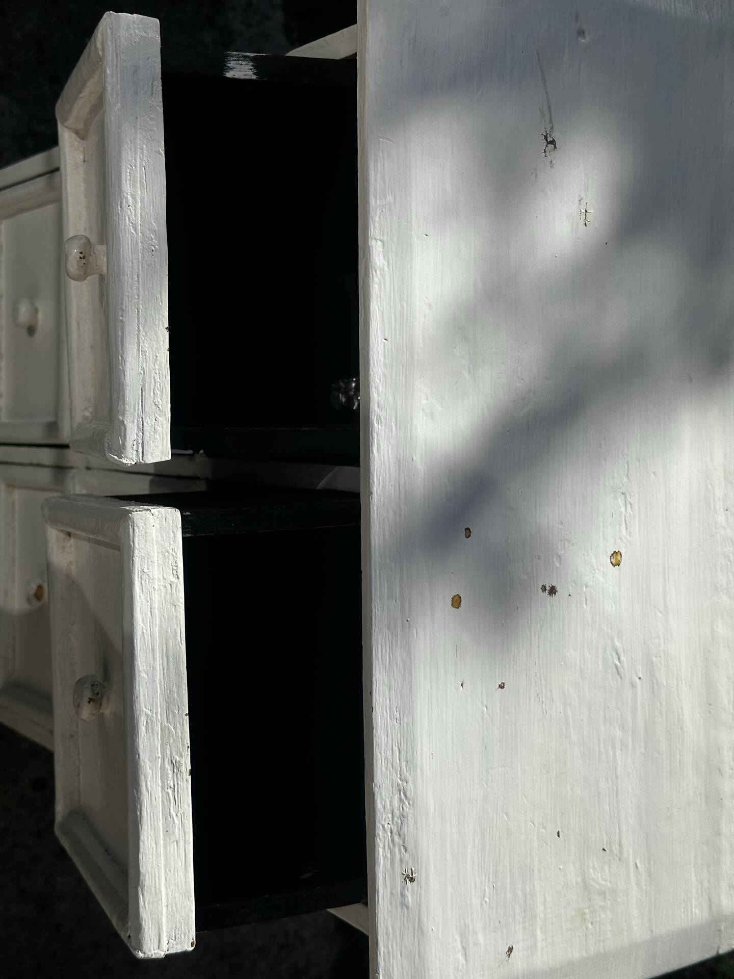 Small antique workshop cabinet with 8 painted wooden drawers.