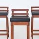 Erik Buck set of three bar stools in teak and leather Dyrlund Denmark 1960