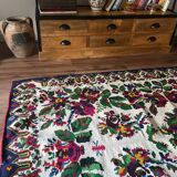 White vintage floral rug made by hand in Romania, beautiful flowers