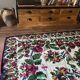 White vintage floral rug made by hand in Romania, beautiful flowers