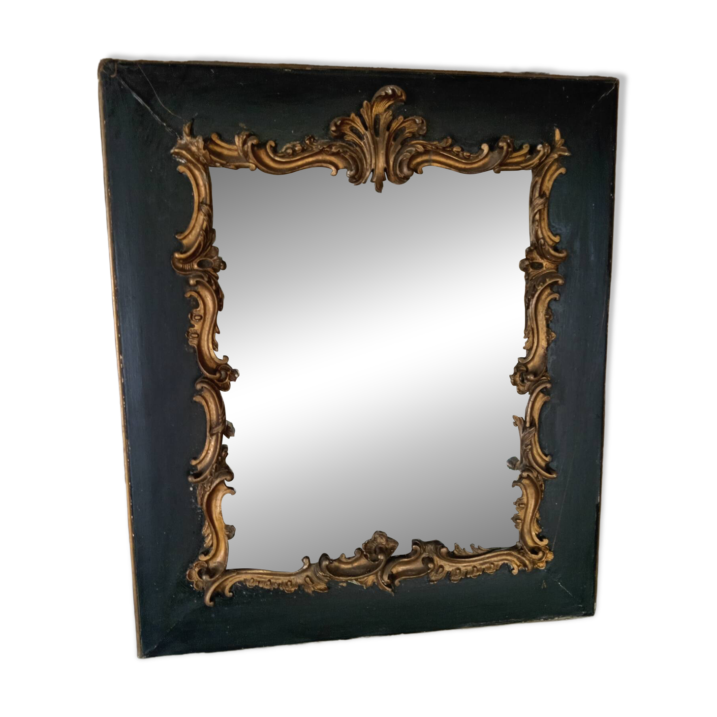 Antique mirror in stucco and wood