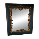 Antique mirror in stucco and wood