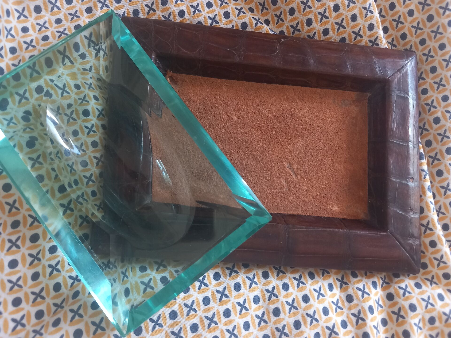 Crocodile leather ashtray with cut crystal.