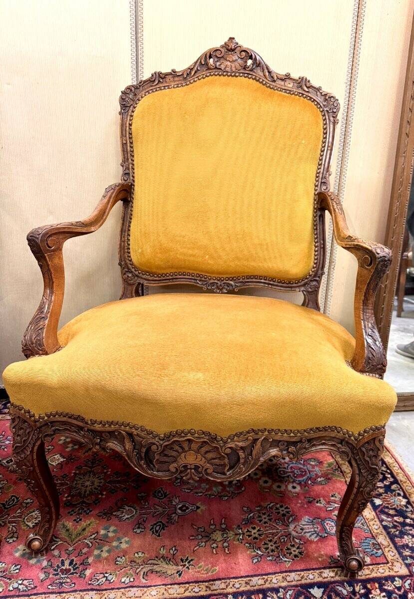 Pair of faux Louis XV armchairs in fully carved walnut