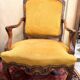 Pair of faux Louis XV armchairs in fully carved walnut