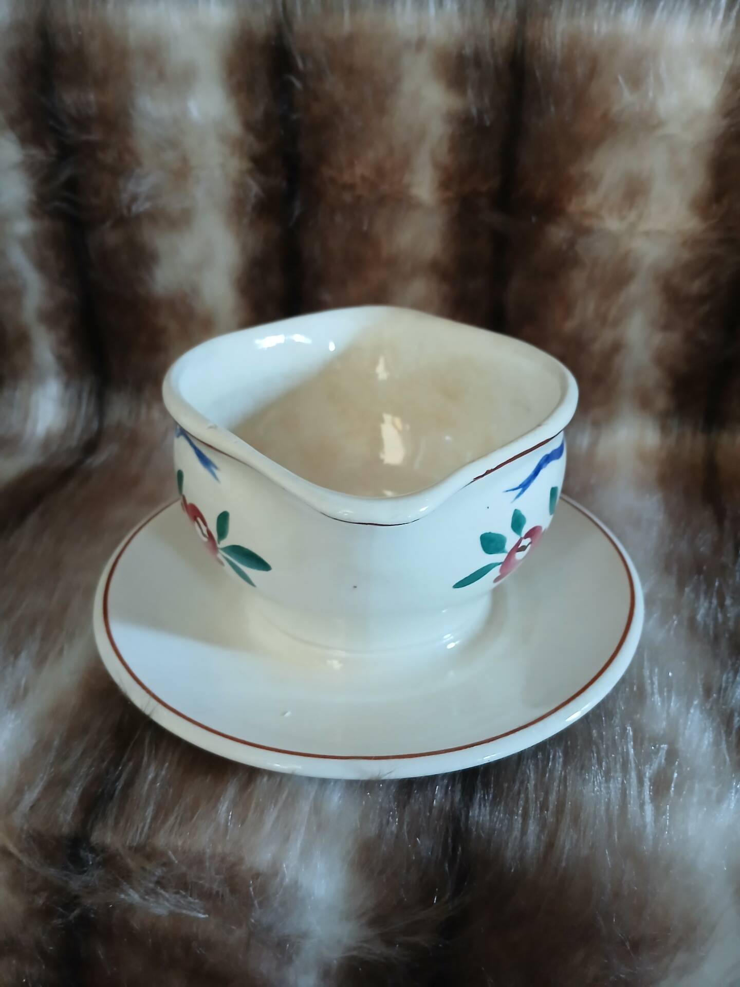 Antique sauce boat in Longchamp ironstone.