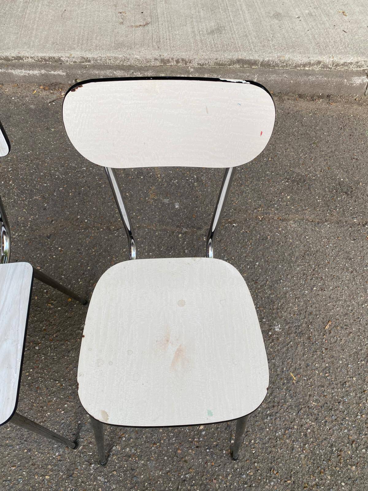 2 beige formica and steel chairs