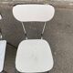 2 beige formica and steel chairs