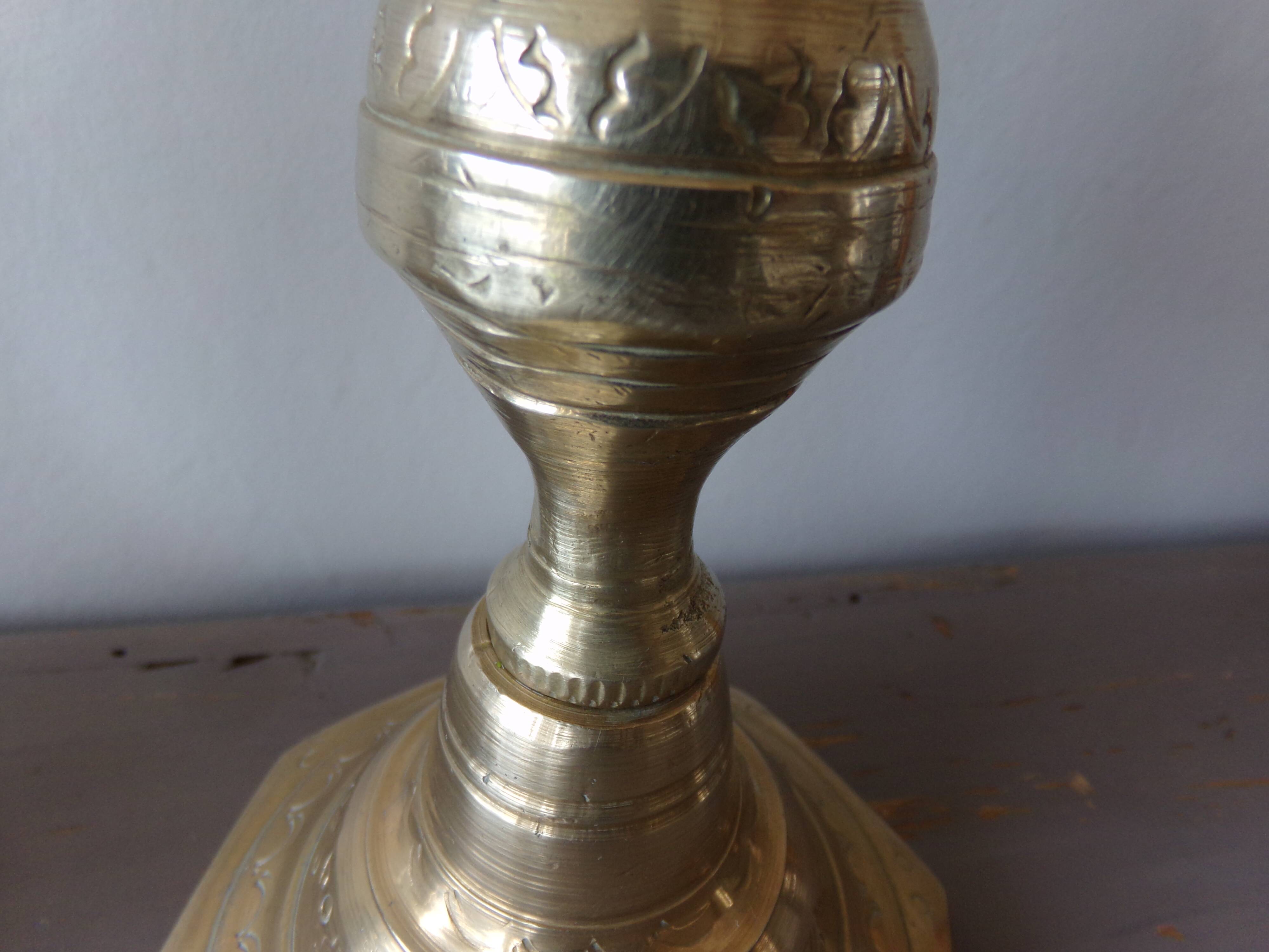 Old candle holder in gilded bronze