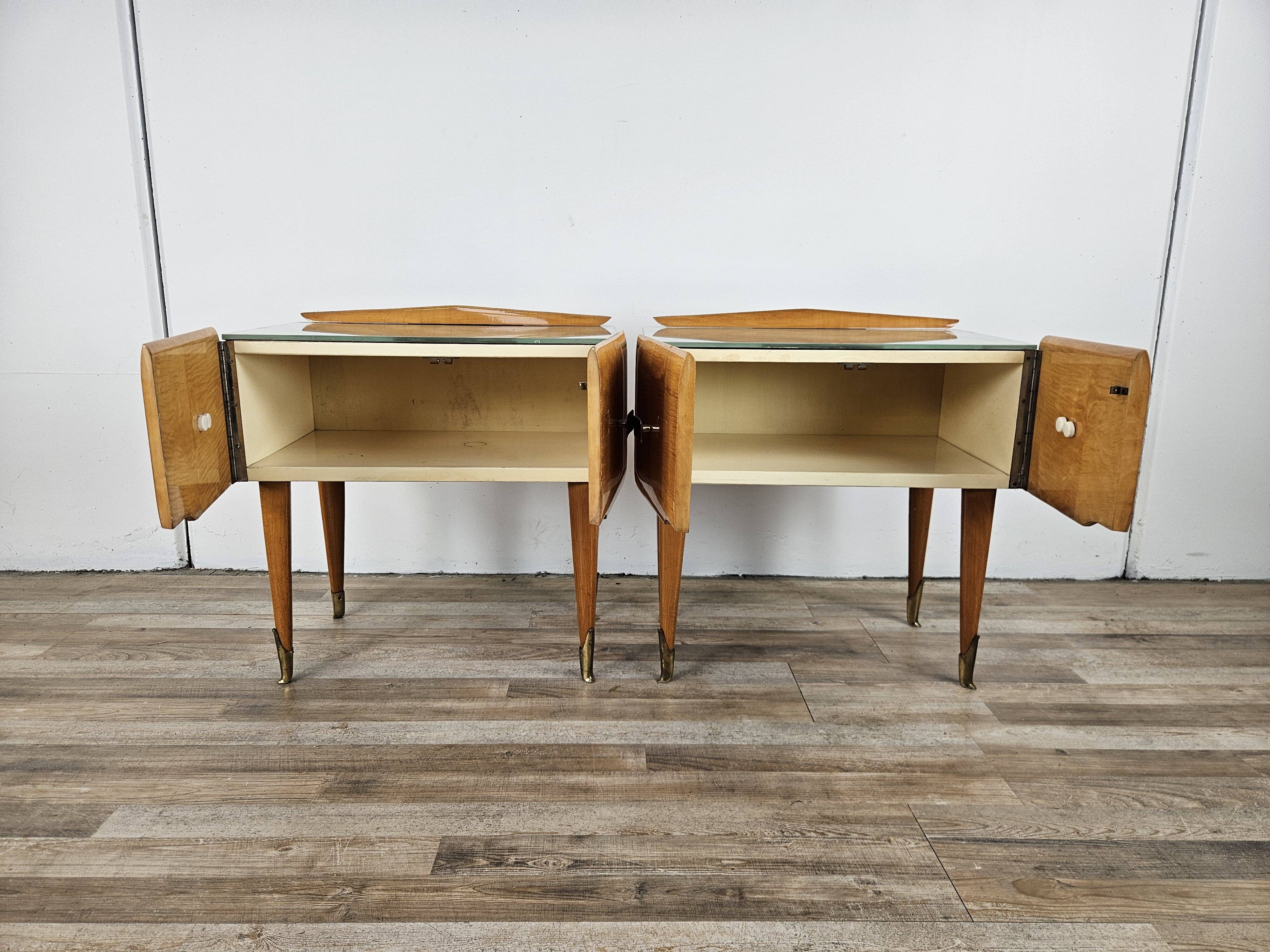 Mid-century nightstands in maple, brass, and glass