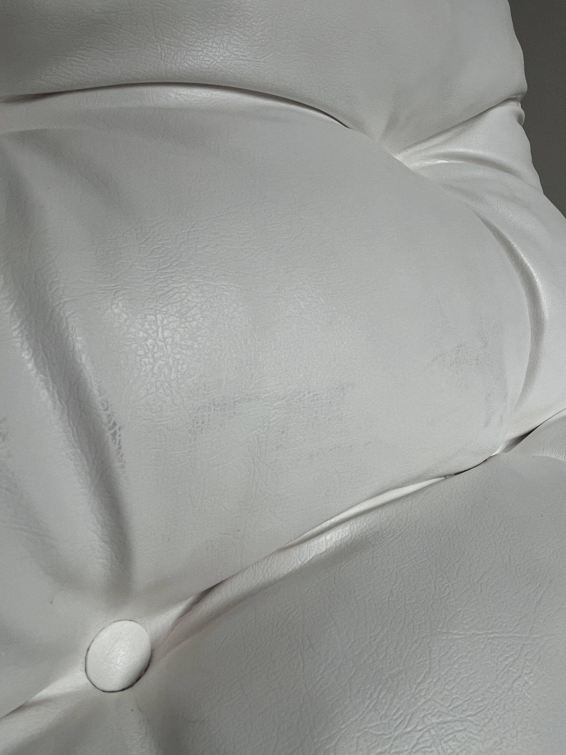 White faux leather armchair by Christian Koban for DOM edition