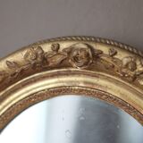Oval wall mirror with gilded frame and mercury glass. Late 19th-early 20th century.