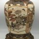 Old satsuma ceramic vase with various decorations mounted on bronze