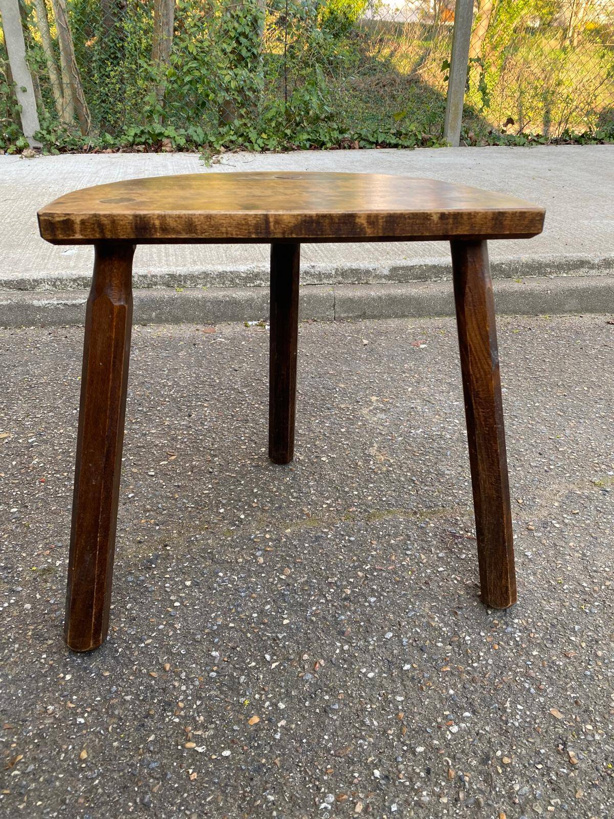Large three-legged solid wood half-moon stool