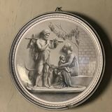 Glazed earthenware tondo in the antique style.