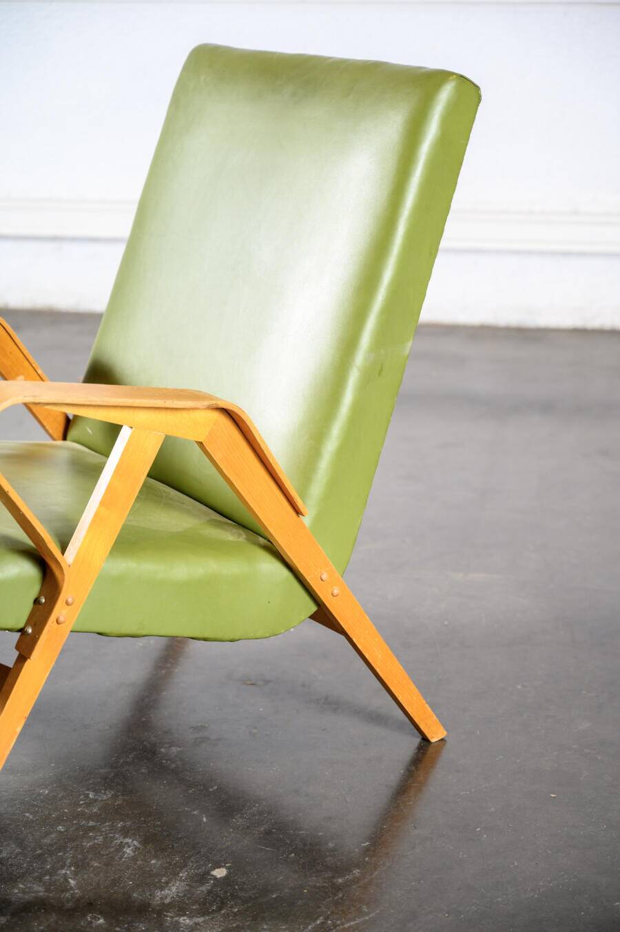 Fauteuil en skaï vert