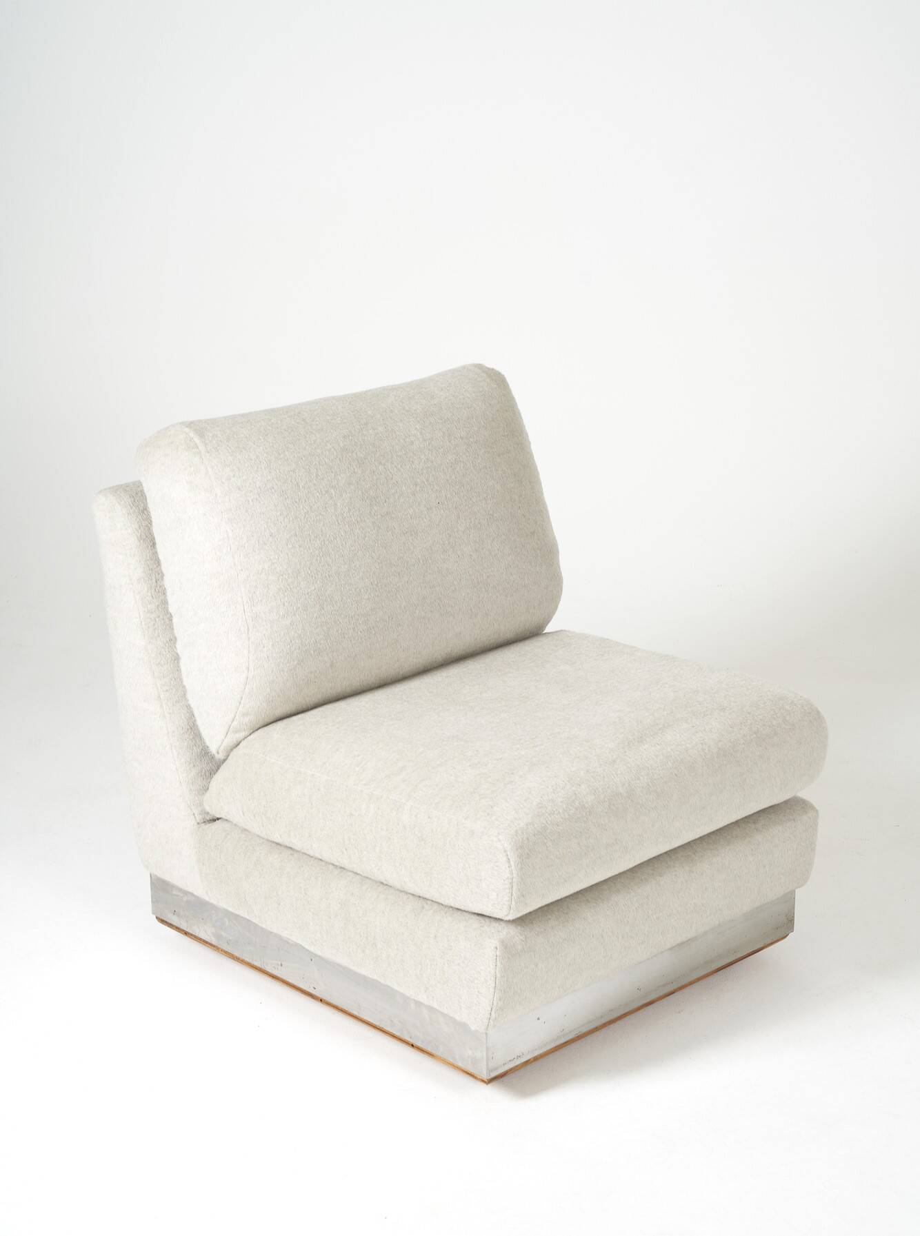 Beige fireside chair by Jacques Charpentier