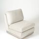 Beige fireside chair by Jacques Charpentier