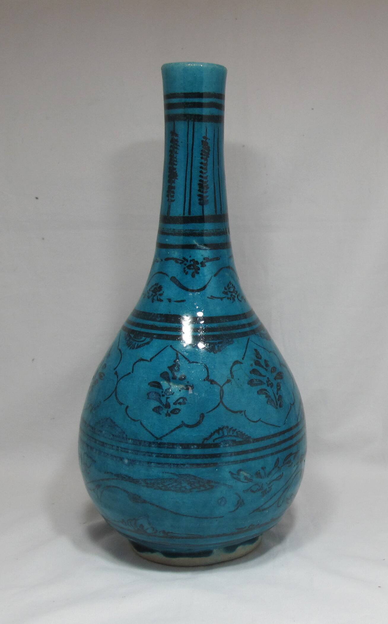 Islamic ceramic vase with turquoise background