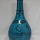 Islamic ceramic vase with turquoise background