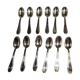 12 silver-plated metal teaspoons with a hallmark of 18.