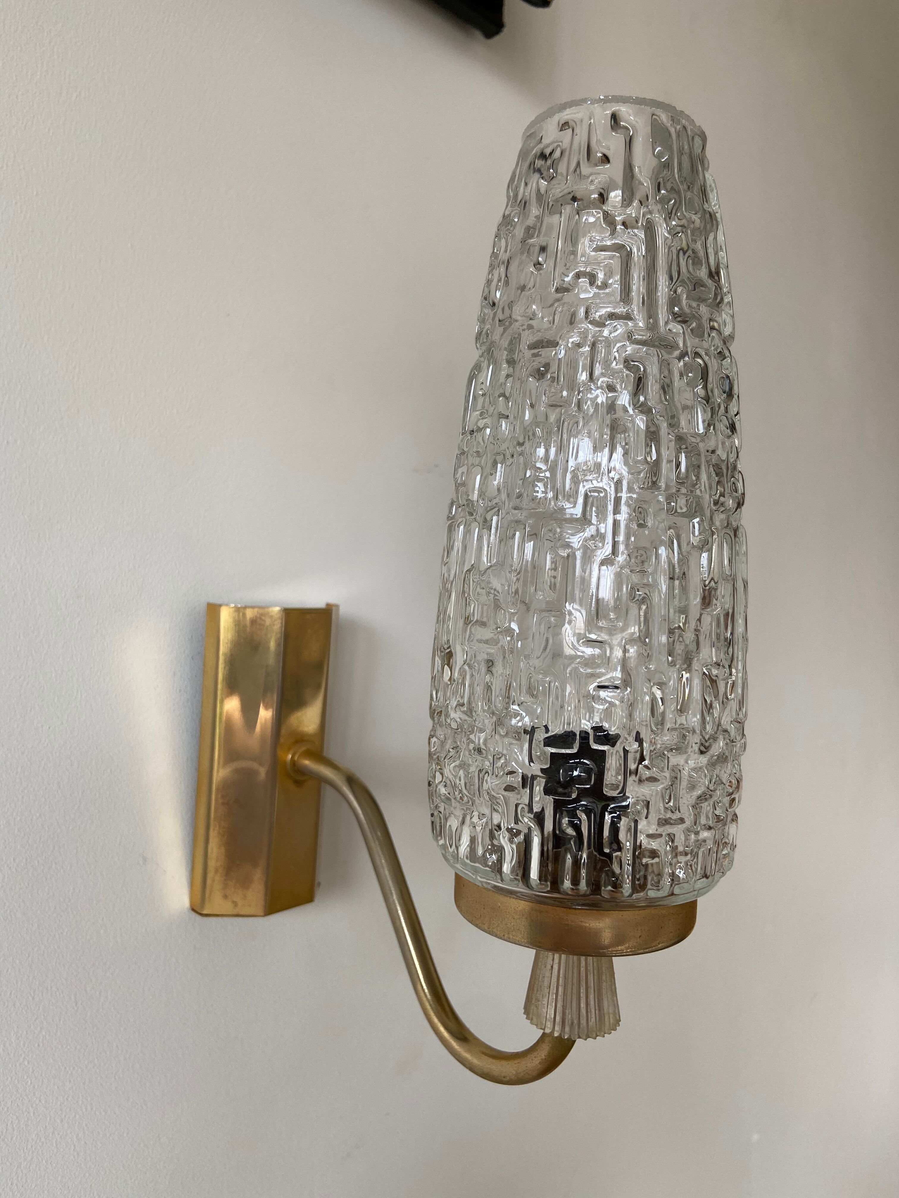Gold metal and chiseled glass wall sconce