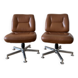 Pair of cognac-colored swivel armchairs