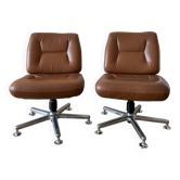 Pair of swivel armchairs in cognac colour.