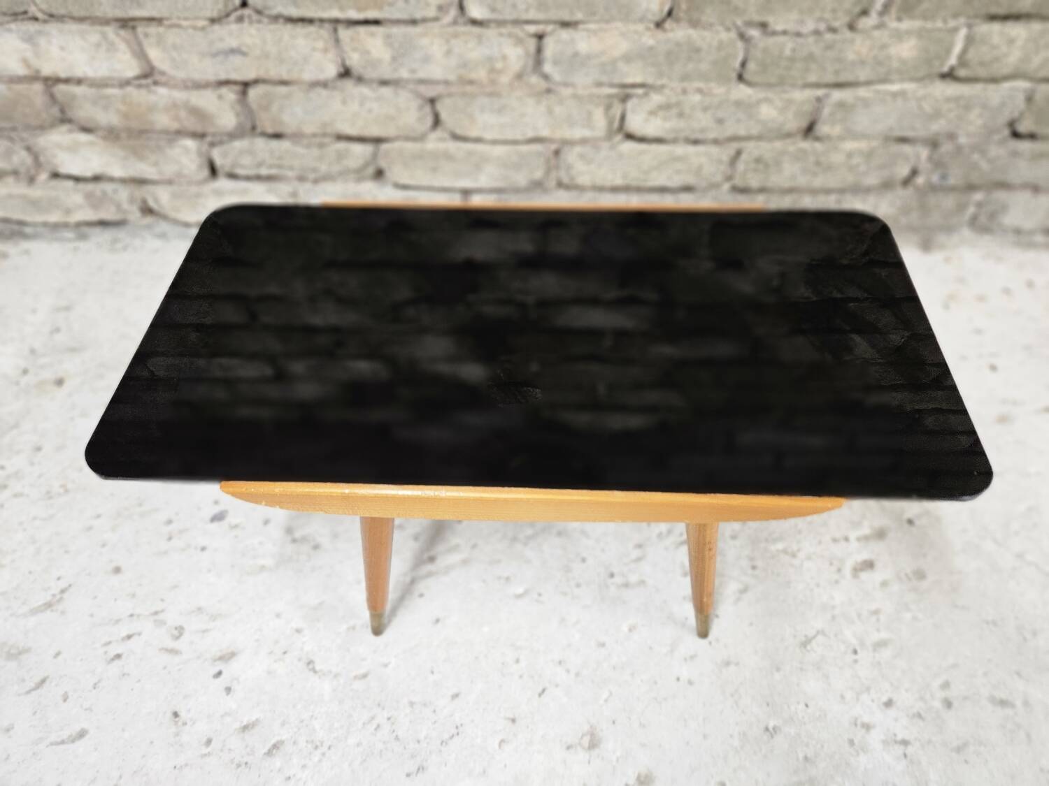 Small opaque black glass coffee table 1960