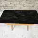 Small opaque black glass coffee table 1960