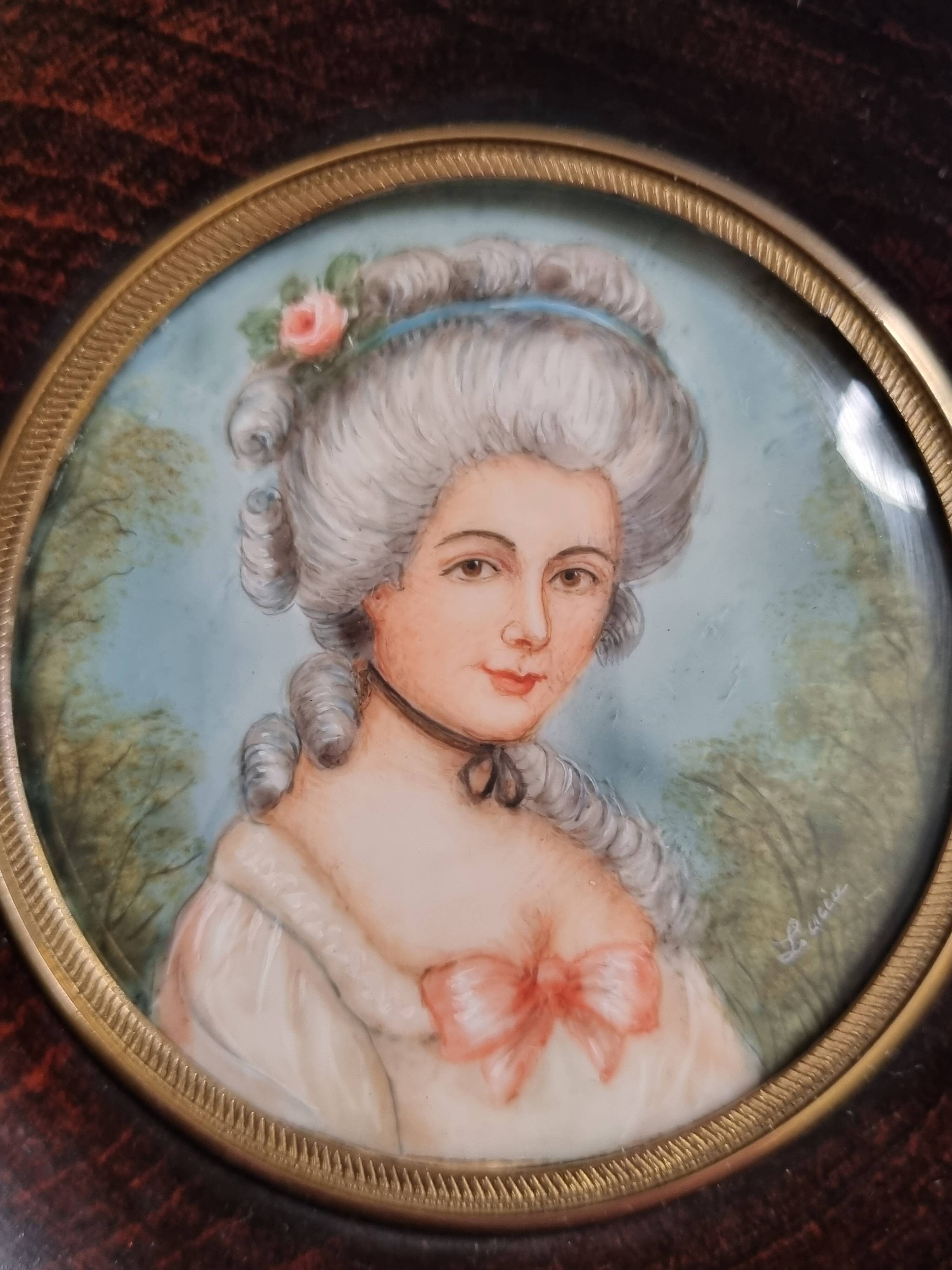Miniature portrait of a woman in the style of Marie Antoinette, signed Lucia, 12 x 12 cm.