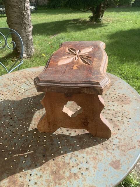 Bench in carved and varnished wood, mountain chalet decoration, old