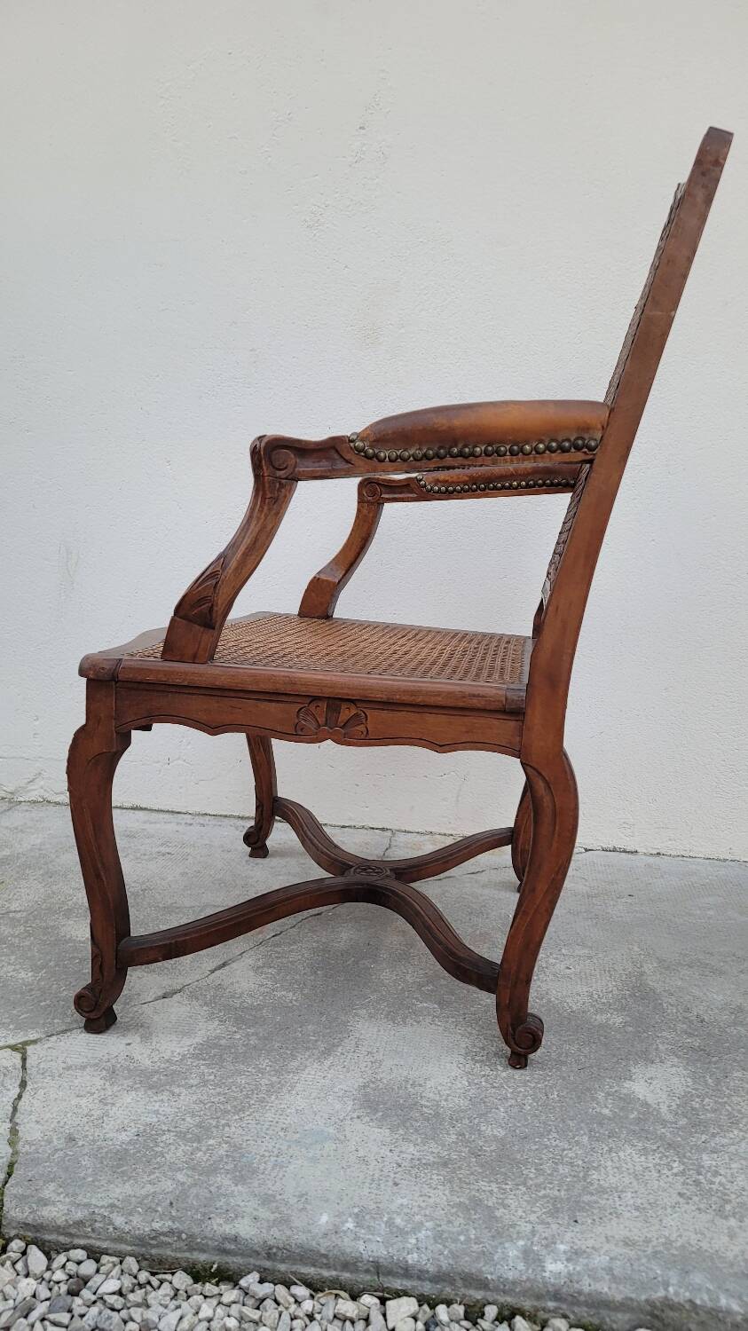 Louis XV Regency cane armchair leather armrests decorated with shell