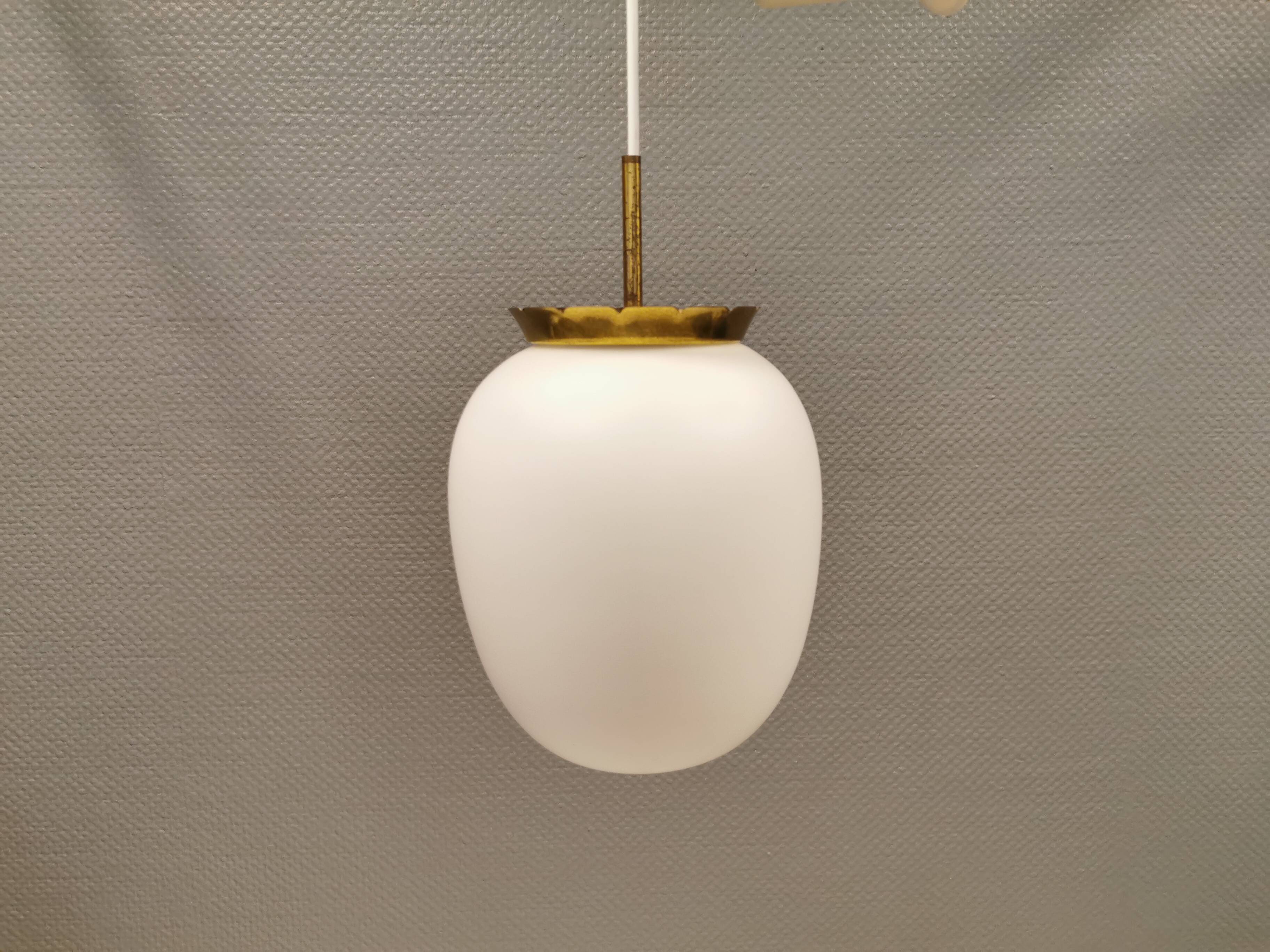 Old hanging lamp in milky white opal glass and brass top/suspension. Danish design 1930s
