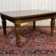 Victorian-style mahogany English table with 3 extensions.