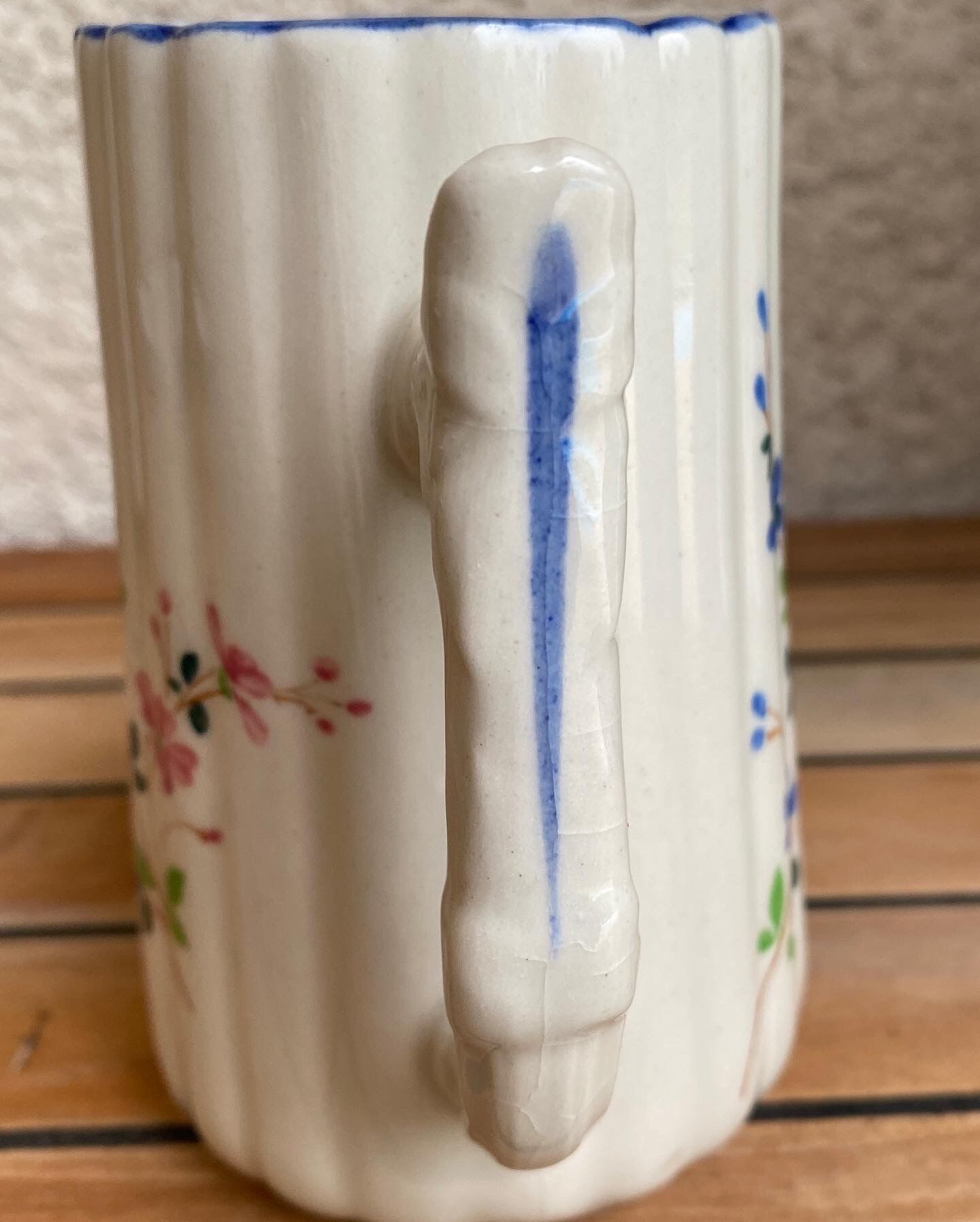 Small pitcher in iron earth with double old decoration