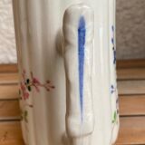 Small pitcher in iron earth with double old decoration