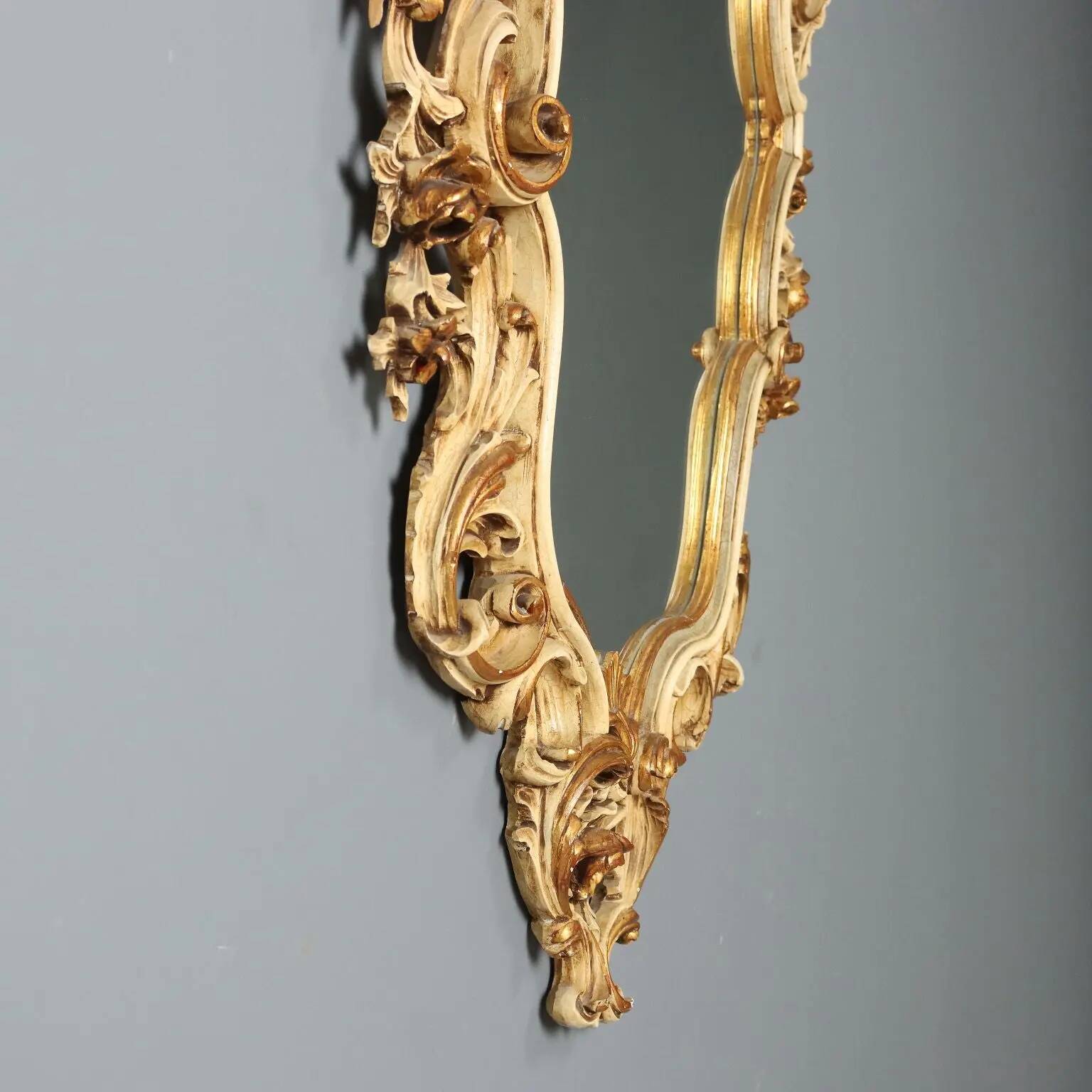 Antique lacquered and gilded wooden mirror, Italy, early 20th century.