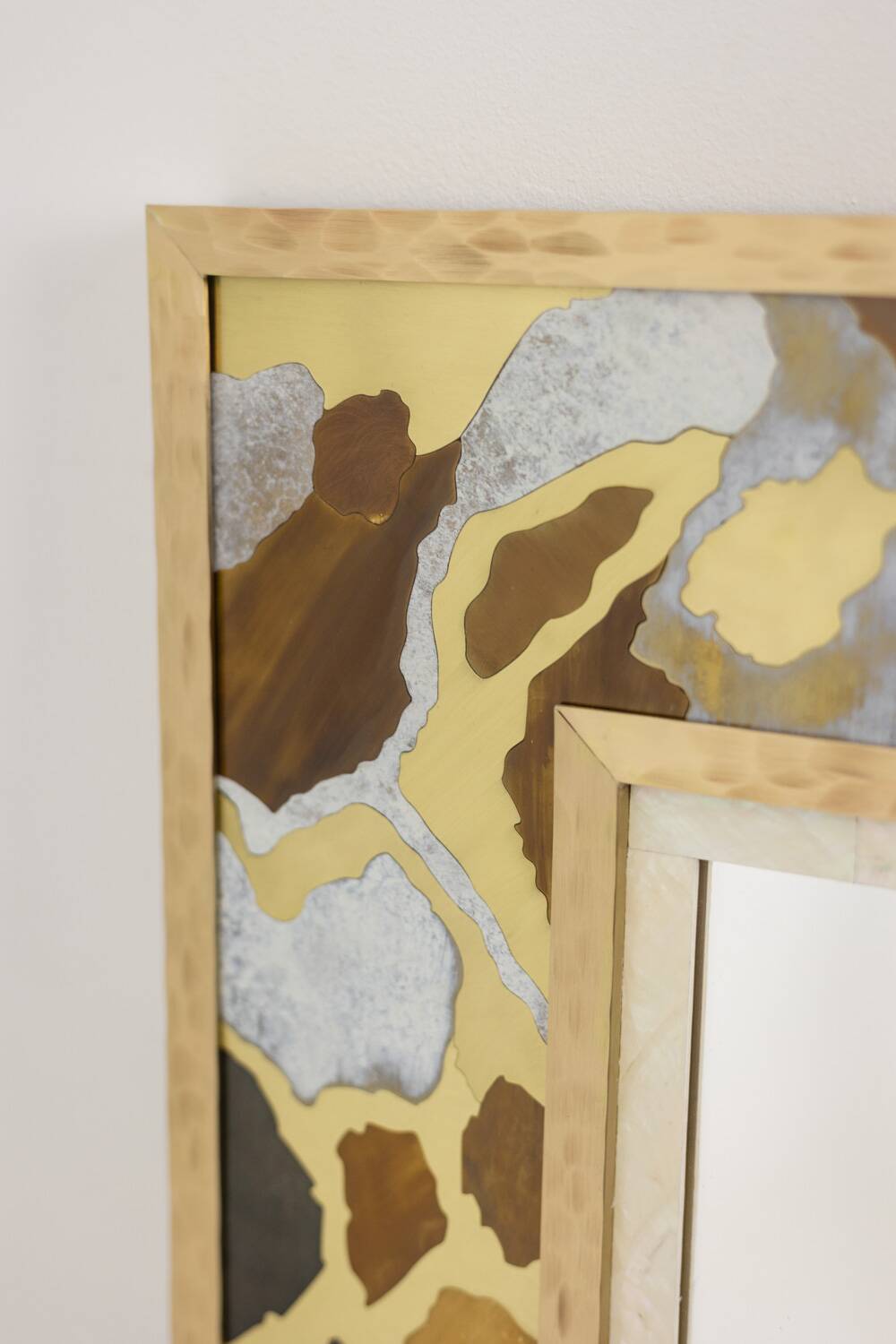 Mirror in marquetry of oxidised and patinated brass. Artist's work.