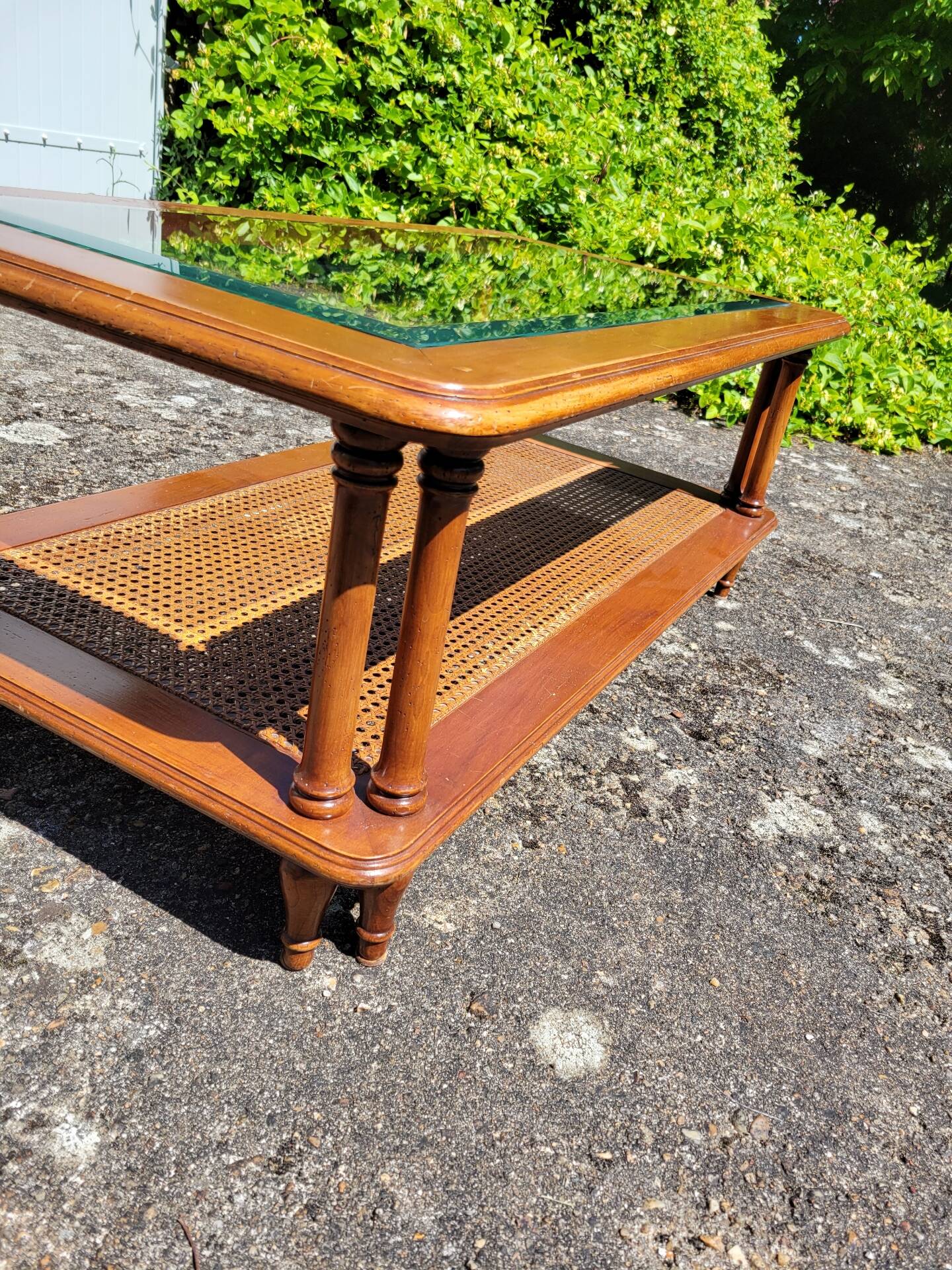 Coffee table in cherry wood, glass and caning.