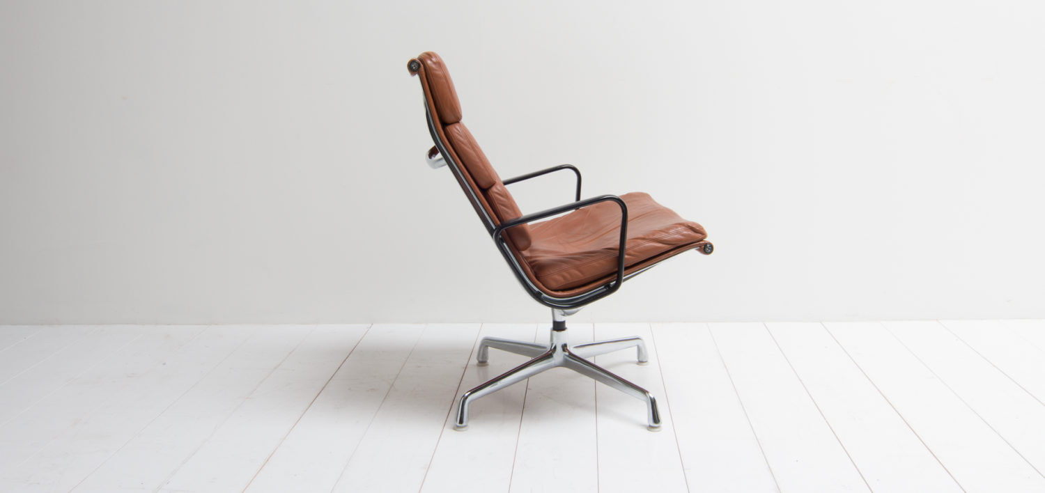Eames lounge chair model EA 216 softpad in cognac