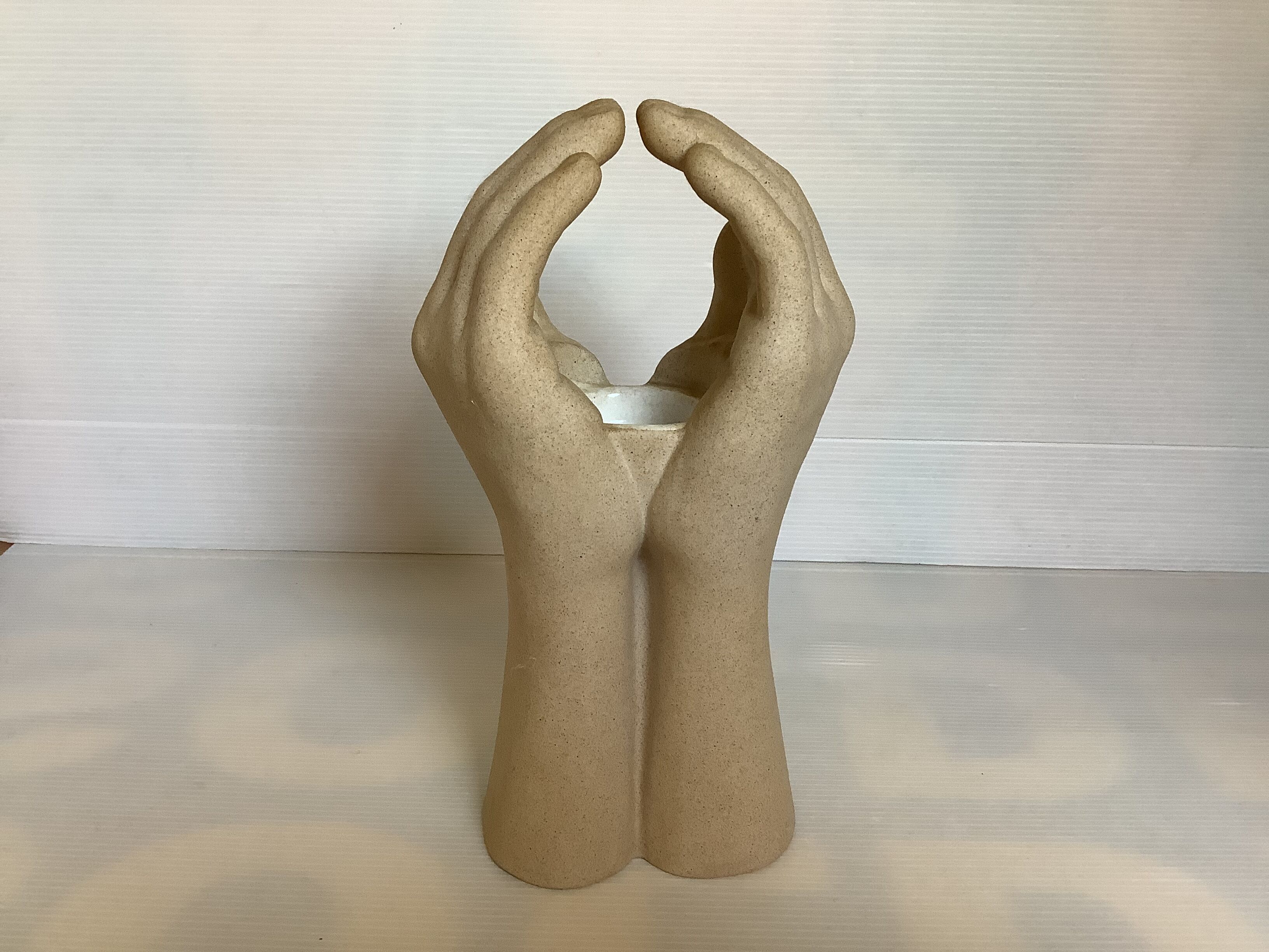 Hand-shaped candle holder